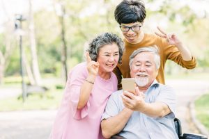 seniors family having fun with smartphone